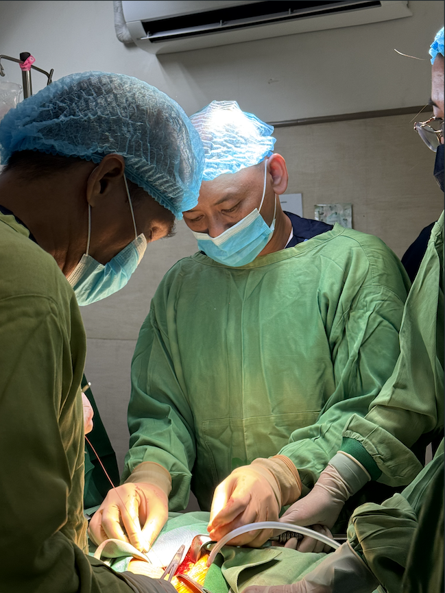 Dr. Tony Hoang near turquoise water in Coron